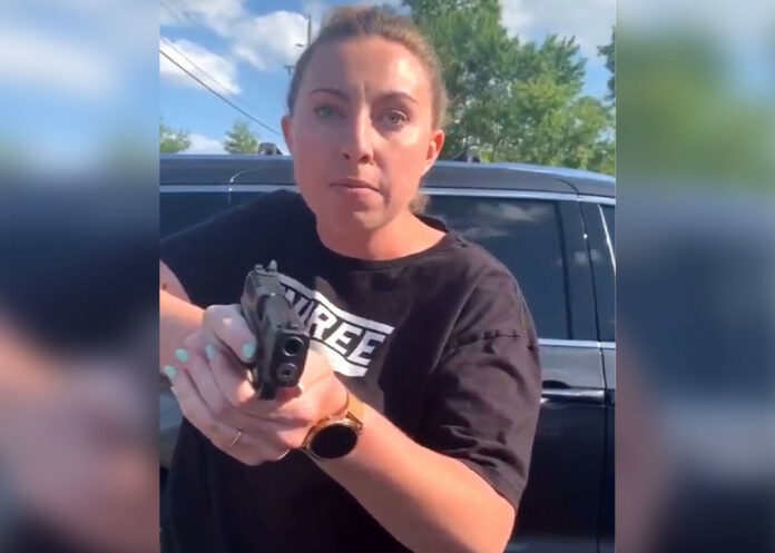 White woman arrested for pulling gun on black woman, daughter in parking lot